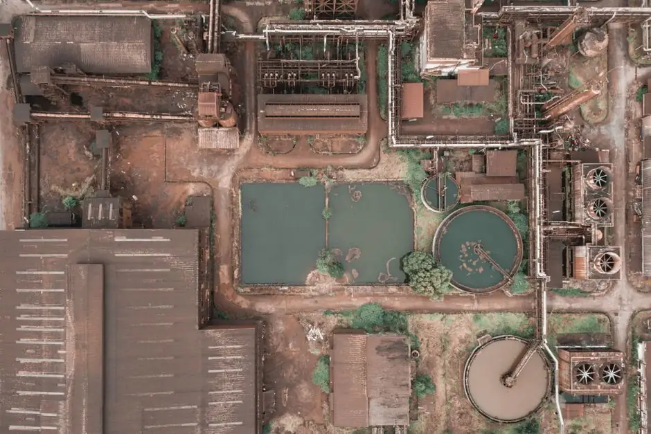 Aerial view of aged industrial area with round tanks for biological sewage water treatment
